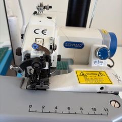 Blind hemming machine