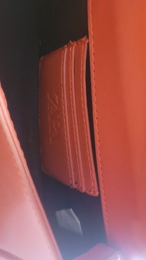 Matching orange shoes and bag