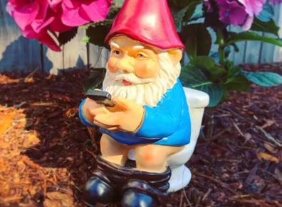 Funny dwarf statue for garden