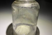 Old clear small glass jar
