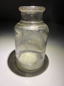 Old clear small glass jar