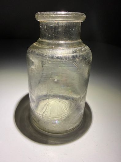 Old clear small glass jar