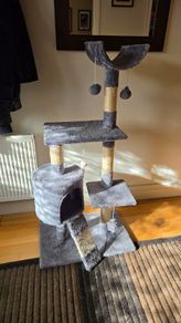 Grey cat tree with scratching posts and hideaway