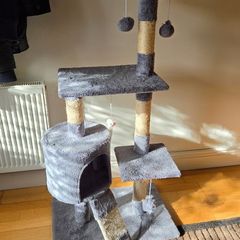 Grey cat tree with scratching posts and hideaway