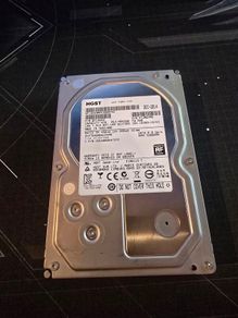HGST Ultrastar 4TB enterprise-grade hard drive, 3.5" SATA 6.0 Gb/s, 7200RPM. Manufactured Dec 2014.