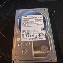 HGST Ultrastar 4TB enterprise-grade hard drive, 3.5" SATA 6.0 Gb/s, 7200RPM. Manufactured Dec 2014.