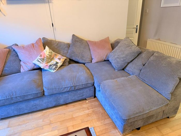 Grey corner couch incl. matching pouffe