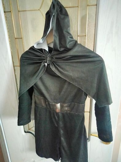 black hooded tunic and cape costume that resembles a Star Wars