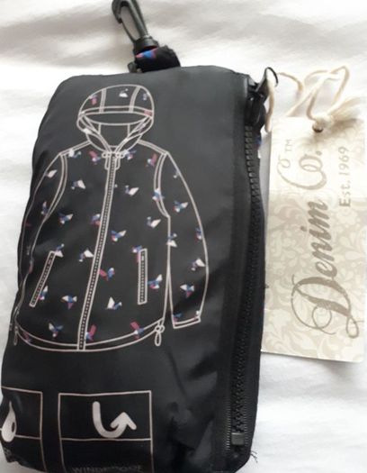 New rain coat with tag attached