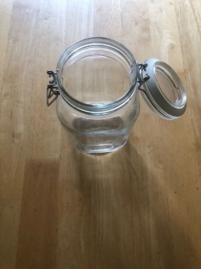 Airtight glass storage jar with clasp