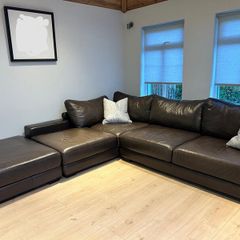 Brown leather corner sofa with footstool