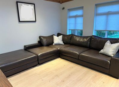 Brown leather corner sofa with footstool