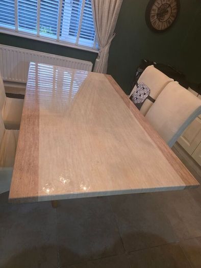 Marble table with 4 cream leather chairs