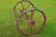 Cast iron set of wheels with axle.