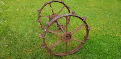 Cast iron set of wheels with axle.