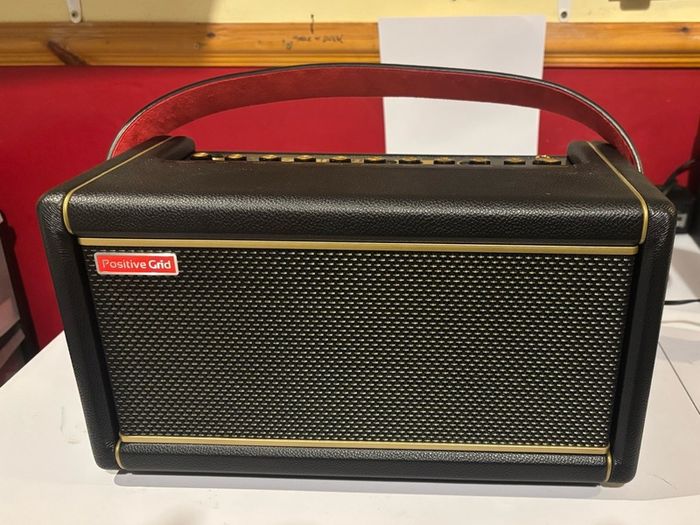 Positive Grid Spark 2 Smart Guitar Amp Bluetooth Speaker, Black with additional battery and carry bag.