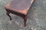 Antique wooden coffee table in need of restoration
