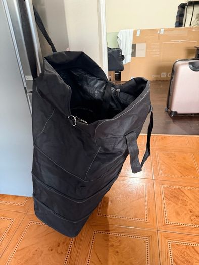 Two extra-large wheeled bags for organizing things; only one zipper doesn't work, but replacing it will make them like new.