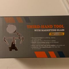 Helping hand with magnifying glass
