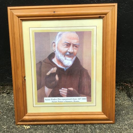Padre Pio picture in wooden frame.