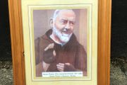 Padre Pio picture in wooden frame.