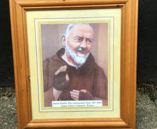 Padre Pio picture in wooden frame.