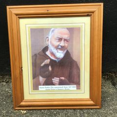 Padre Pio picture in wooden frame.