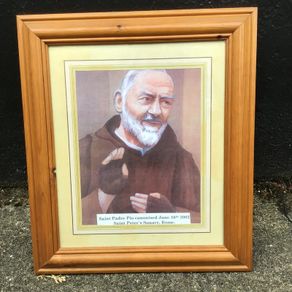 Padre Pio picture in wooden frame.