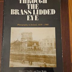 Through The Brass Lidded Eye. Photography In Ireland, 1839- 1900. By Edward Chandler And Peter Walsh. First Edition Large Volume Paperback In Good Condition.  See Photos For Same.