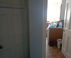Tall white shelving unit