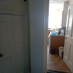 Tall white shelving unit