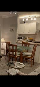 Dining table with glass top & 4 chairs