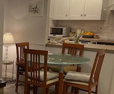 Dining table with glass top & 4 chairs
