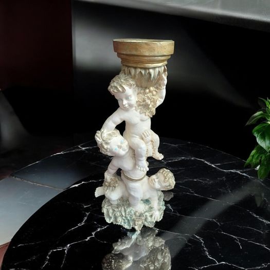Ornate tall cherubic candle holder, D18