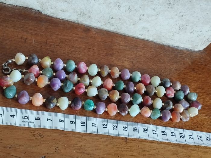 Necklace of multicolored artificial stones.