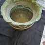 Antique Copper Jardiniere Planter, likely dating from around 1880s to 1920s. It features a distinctive scalloped, or frilled, edge rim. The body is adorned with embossed floral and swag designs. Image 2