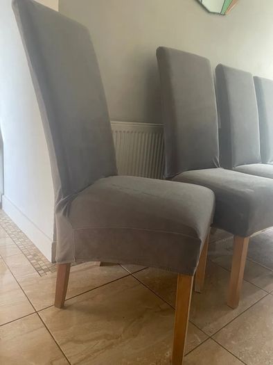 4 dark brown dining room chairs & 4 stretch covers