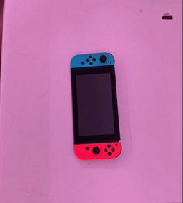 nintendo switch and 2 games