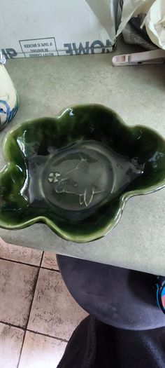 3 different items. No. 1- Mid-Century Porcelain Teapots, Japan, 1960.  95.00 euro. 2- VTG Hand Painted Le Poet Laval France Serving Plate 22.00 euro. 3- Vintage Short Dark Forest Green Ceramic 22.00 euro.