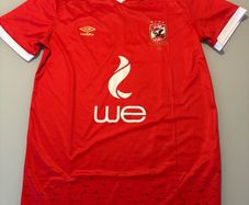 Renowned Egyptian club Al Ahly Umbro home jersey. Rare item. In superb condition. Size Large. Looks genuine but can't be sure. Made in Egypt. Bargain.