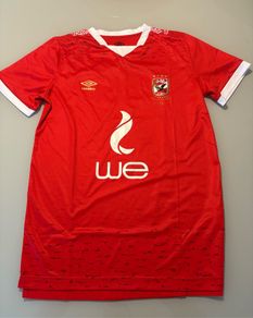 Renowned Egyptian club Al Ahly Umbro home jersey. Rare item. In superb condition. Size Large. Looks genuine but can't be sure. Made in Egypt. Bargain.