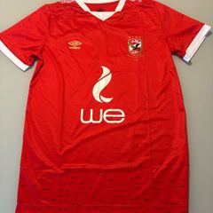 Renowned Egyptian club Al Ahly Umbro home jersey. Rare item. In superb condition. Size Large. Looks genuine but can't be sure. Made in Egypt. Bargain.