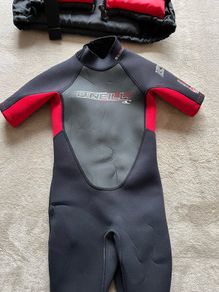 O'Neill child's 2mm shorty wetsuit and buoyancy aid.