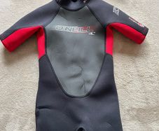 O'Neill child's 2mm shorty wetsuit and buoyancy aid.