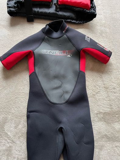 O'Neill child's 2mm shorty wetsuit and buoyancy aid.