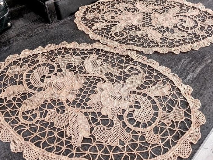 Pair of crocheted table clothes