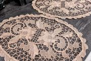 Pair of crocheted table clothes