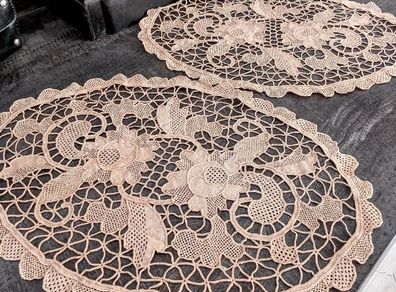 Pair of crocheted table clothes