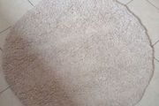 round cream rug