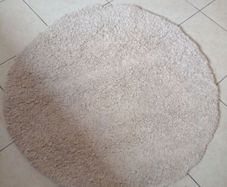 round cream rug